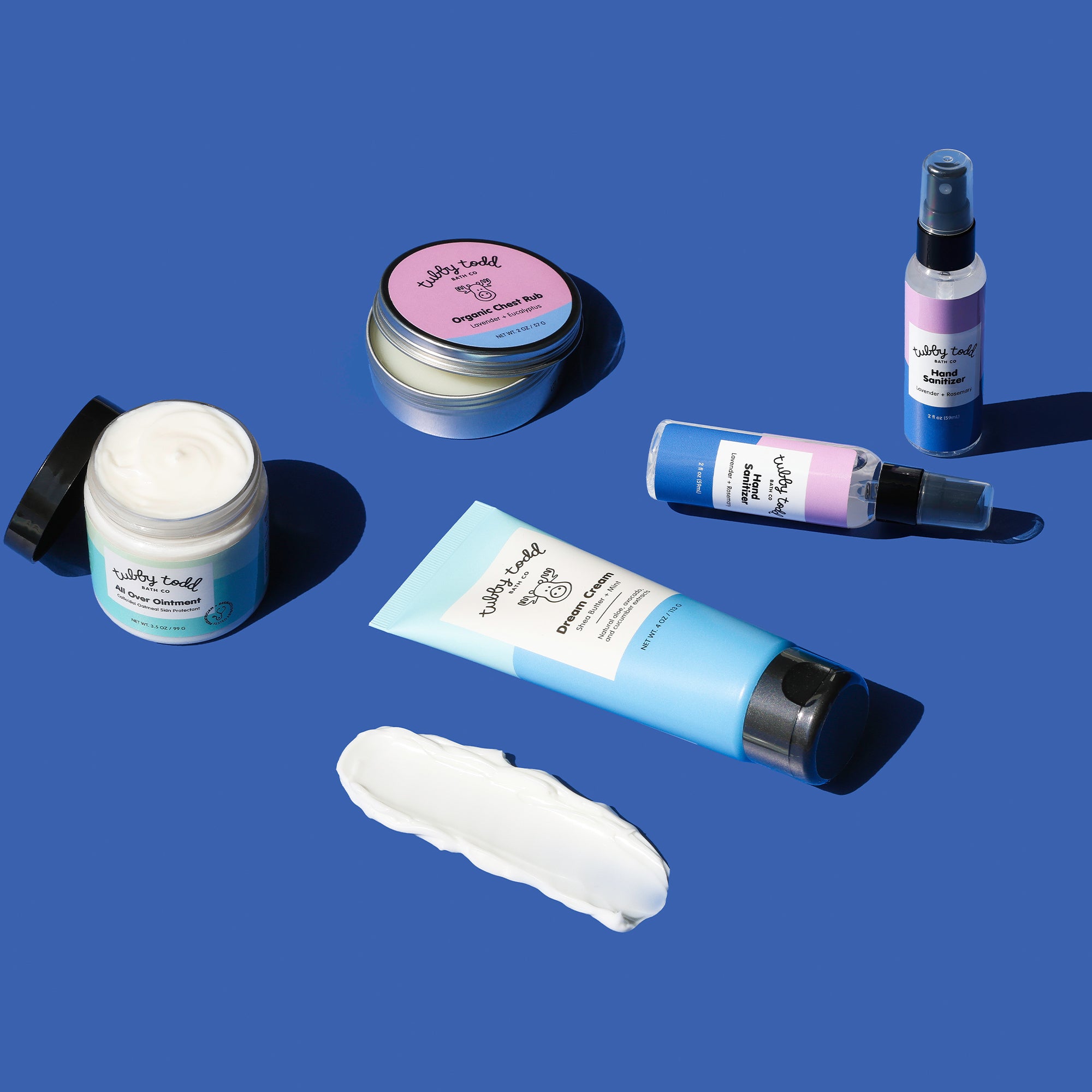 Collection of Tubby Todd Winter Bundle skincare products on a blue background